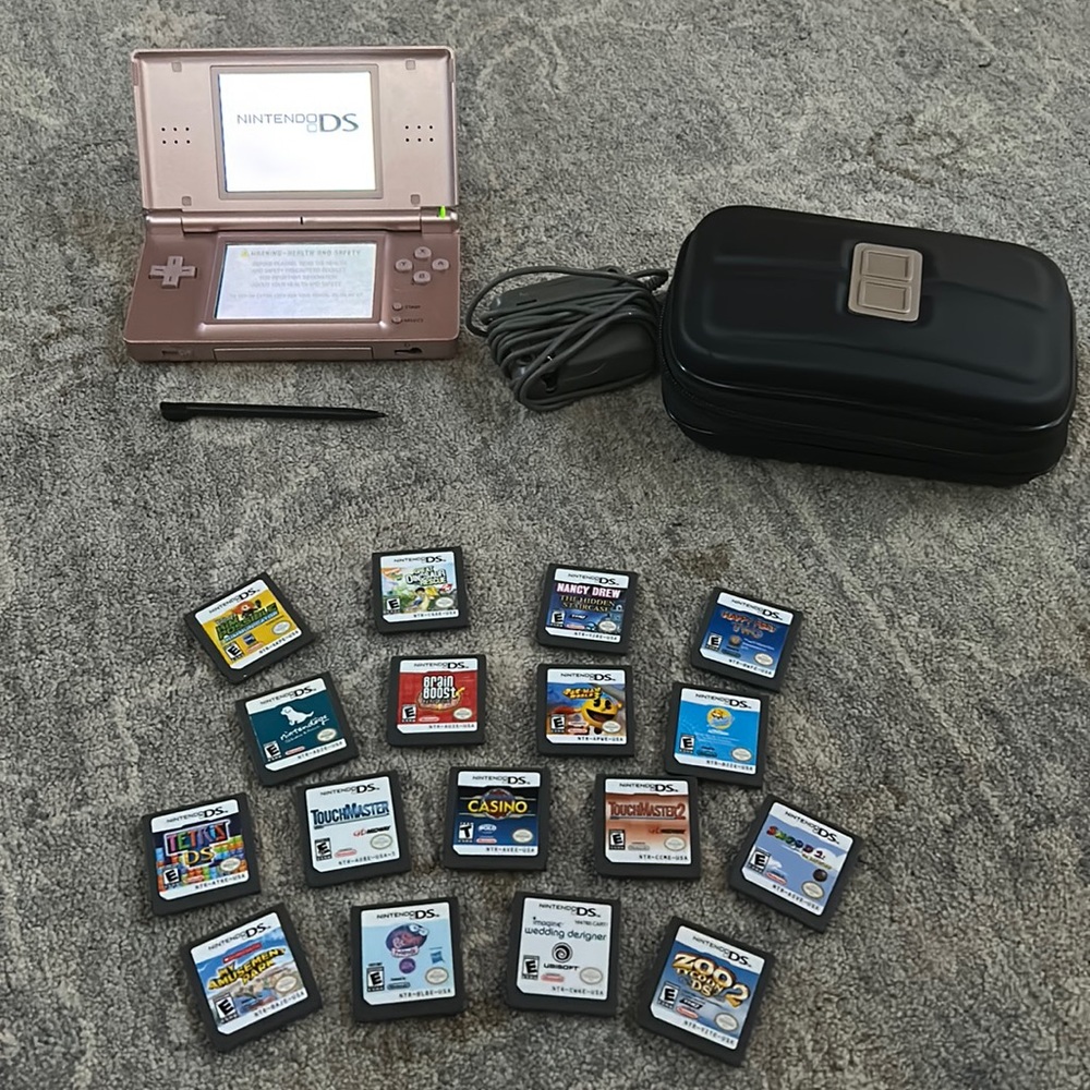 Rose gold Nintendo ds with games and accessories